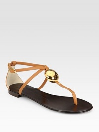 Rich leather t-strap with an adjustable, wrap-around ankle strap and a gleaming goldtone adornment. Leather upperLeather lining and solePadded insoleMade in ItalyOUR FIT MODEL RECOMMENDS ordering true size. Rich leather t-strap with an adjustable, wrap-around ankle strap and a gleaming goldtone adornment. Leather upperLeather lining and solePadded insoleMade in ItalyOUR FIT MODEL RECOMMENDS ordering true size.