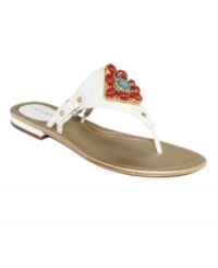 The focal point of fashion. Tahari's Dash flat thong sandals feature a colorful jewel detail at the vamp that will complement any of the season's pretty outfits. The focal point of fashion. Tahari's Dash flat thong sandals feature a colorful jewel detail at the vamp that will complement any of the season's pretty outfits.