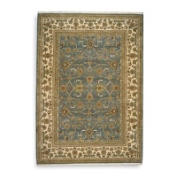 Modeled after the world's most prized antique textiles, this luxuriant Karastan rug lends opulence and heirloom beauty to your home. Surrounded by a light border to add depth and contrast, the stylized pattern depicts lush flora and curvilinear accents. First introduced in 1928, the Original Karastan Collection established the highest standard for traditional Oriental machine woven rugs.