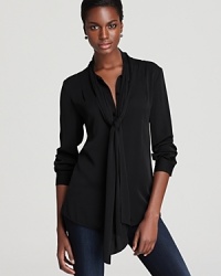 Wrap things up in DIANE von FURSTENBERG's New Edde blouse. Completely classic, it gives off a feminine finish with a secretary tie at the neck. Wrap things up in DIANE von FURSTENBERG's New Edde blouse. Completely classic, it gives off a feminine finish with a secretary tie at the neck.