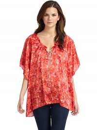 THE LOOKAllover brushstroke floral printV-neck with ruffle detailFront keyhole with rope tie closureDraped dolman sleevesTHE FITAbout 29 from shoulder to hemTHE MATERIALViscoseCARE & ORIGINDry cleanMade in USAModel shown is 5'11 (180cm) wearing US size Small. THE LOOKAllover brushstroke floral printV-neck with ruffle detailFront keyhole with rope tie closureDraped dolman sleevesTHE FITAbout 29 from shoulder to hemTHE MATERIALViscoseCARE & ORIGINDry cleanMade in USAModel shown is 5'11 (180cm) wearing US size Small.