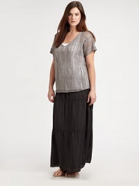 Try tiers this season for a flattering look. This silk maxi skirt has it all, including a concealed side zipper.Elasticized waistSide zipperTiered designAbout 38 longSilkDry cleanImported Try tiers this season for a flattering look. This silk maxi skirt has it all, including a concealed side zipper.Elasticized waistSide zipperTiered designAbout 38 longSilkDry cleanImported