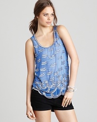 Silver beads and sequins decorate a pastel Aqua tank for a playfully chic look you can dress up or down. Silver beads and sequins decorate a pastel Aqua tank for a playfully chic look you can dress up or down.
