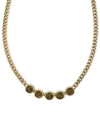Subtle chic. Jessica Simpson's frontal necklace, crafted from gold-tone mixed metal, features a row of glass light topaz stones for a stylishly understated approach. Approximate length: 16 inches. Subtle chic. Jessica Simpson's frontal necklace, crafted from gold-tone mixed metal, features a row of glass light topaz stones for a stylishly understated approach. Approximate length: 16 inches.