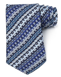 An assortment of symbols and puzzle-like pieces pattern into stripes on this enchanting tie from Emilio Pucci, rendered in pure Italian silk for an opulent touch. An assortment of symbols and puzzle-like pieces pattern into stripes on this enchanting tie from Emilio Pucci, rendered in pure Italian silk for an opulent touch.