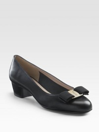A modern silhouette of luxe leather with Ferragamo's classic logo and ribbon detail.Stacked heel, 1½ (40mm) Round toe Leather lining and sole Padded insole Made in ItalyOUR FIT MODEL RECOMMENDS ordering true size.. A modern silhouette of luxe leather with Ferragamo's classic logo and ribbon detail.Stacked heel, 1½ (40mm) Round toe Leather lining and sole Padded insole Made in ItalyOUR FIT MODEL RECOMMENDS ordering true size..
