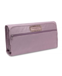 An understated design packs in true polish and sophistication for an always-smooth landing. The coordinating amethyst lining adds a lively contrast that guarantees style is always in the bag. An understated design packs in true polish and sophistication for an always-smooth landing. The coordinating amethyst lining adds a lively contrast that guarantees style is always in the bag.