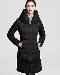 Worn with or without the fur hem, this Elie Tahari coat makes a sophisticated statement this season. Perfect for your day-to-night wardrobe, this is one piece every jet-setter should own. Worn with or without the fur hem, this Elie Tahari coat makes a sophisticated statement this season. Perfect for your day-to-night wardrobe, this is one piece every jet-setter should own.