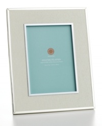 Wrap up major milestones in your life with this elegant frame. Ivory ribbon and silver-plated inner and outer rims frame the moments you never want to forget. Wrap up major milestones in your life with this elegant frame. Ivory ribbon and silver-plated inner and outer rims frame the moments you never want to forget.