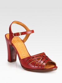 A moderate block heel lifts this textured leather silhouette with geometric skin-baring cutouts. Self-covered heel, 3½ (90mm)Textured leather upperAdjustable ankle strapLeather lining and solePadded insoleMade in Spain A moderate block heel lifts this textured leather silhouette with geometric skin-baring cutouts. Self-covered heel, 3½ (90mm)Textured leather upperAdjustable ankle strapLeather lining and solePadded insoleMade in Spain