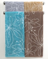Your bath, in bloom. Featuring a stencil design of modern lilies, this Bianca hand towel blossoms in refreshing hues and soft terry. Contrast pattern on reverse. Your bath, in bloom. Featuring a stencil design of modern lilies, this Bianca hand towel blossoms in refreshing hues and soft terry. Contrast pattern on reverse.