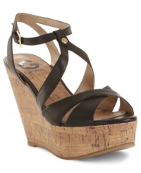 Slender criss cross straps on G by Guess's Tenor platforms add intrigue to a classic wedge silhouette. Slender criss cross straps on G by Guess's Tenor platforms add intrigue to a classic wedge silhouette.