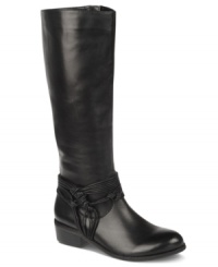 Knotted rope-like straps around the ankle add even more equestrian flair to the Wellington riding boots by Carlos by Carlos Santana. Knotted rope-like straps around the ankle add even more equestrian flair to the Wellington riding boots by Carlos by Carlos Santana.