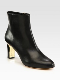 A sleek and sexy design of fine Italian leather with an unexpected goldtone heel. Stacked and lacquered heel, 2¾ (70mm)Leather upperSide zipLeather lining and solePadded insoleMade in ItalyOUR FIT MODEL RECOMMENDS ordering one half size up as this style runs small. A sleek and sexy design of fine Italian leather with an unexpected goldtone heel. Stacked and lacquered heel, 2¾ (70mm)Leather upperSide zipLeather lining and solePadded insoleMade in ItalyOUR FIT MODEL RECOMMENDS ordering one half size up as this style runs small.