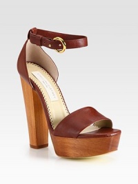 An adjustable ankle strap wraps around this chic faux leather design, resting on a tall wooden platform heel. Wooden heel, 5½ (140mm)Wooden platform, 1¼ (30mm)Compares to a 4¼ heel (110mm)Faux leather upperFaux leather liningRubber trek solePadded insoleMade in ItalyThis style runs large. We recommend ordering one half size down for a standard fit. An adjustable ankle strap wraps around this chic faux leather design, resting on a tall wooden platform heel. Wooden heel, 5½ (140mm)Wooden platform, 1¼ (30mm)Compares to a 4¼ heel (110mm)Faux leather upperFaux leather liningRubber trek solePadded insoleMade in ItalyThis style runs large. We recommend ordering one half size down for a standard fit.