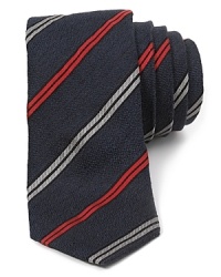 Made from premium silk with a bit of cotton added for strength, this sleek skinny tie adds a modern dose of style to your look. Made from premium silk with a bit of cotton added for strength, this sleek skinny tie adds a modern dose of style to your look.
