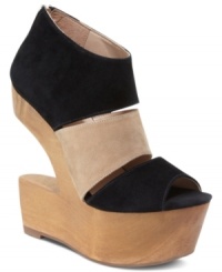 A work of shoe art. The Julia wedge sandals from DV by Dolce Vita combine alluring heights, a chic cut-out wedge and contrasting colors that make any look pop. (Clearance) A work of shoe art. The Julia wedge sandals from DV by Dolce Vita combine alluring heights, a chic cut-out wedge and contrasting colors that make any look pop. (Clearance)