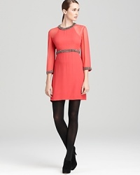 Beautiful silver beads enliven this coral-colored French Connection dress, crafted from pure silk with flattering three-quarter sleeves. Beautiful silver beads enliven this coral-colored French Connection dress, crafted from pure silk with flattering three-quarter sleeves.