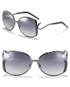 Grey gets glam in oversize Roberto Cavalli shades. Swirled gunmetal stems and ridged frames add an industrial-chic touch.