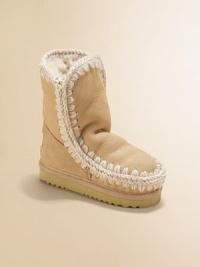 Textural wool stitching adorns this wonderfully warm sheepskin style.Pull-on style Metallic leather upper EVA sole Padded insole Sheepskin lining Imported Textural wool stitching adorns this wonderfully warm sheepskin style.Pull-on style Metallic leather upper EVA sole Padded insole Sheepskin lining Imported