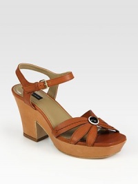 Fastened by an adjustable slingback, artfully crafted leather straps take on a daisy-like form. Self-covered heel, 3½ (90mm)Covered platform, 1½ (40mm)Compares to a 2 heel (50mm)Leather upperLeather lining and solePadded insoleMade in ItalyOUR FIT MODEL RECOMMENDS ordering one half size up as this style runs small. Fastened by an adjustable slingback, artfully crafted leather straps take on a daisy-like form. Self-covered heel, 3½ (90mm)Covered platform, 1½ (40mm)Compares to a 2 heel (50mm)Leather upperLeather lining and solePadded insoleMade in ItalyOUR FIT MODEL RECOMMENDS ordering one half size up as this style runs small.