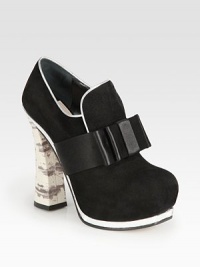 A satin bow adds textural appeal to this suede platform pump with metallic trim and a snake-print leather banana heel. Snake-embossed leather heel, 5¼ (130mm)Hidden platform, 1½ (40mm)Compares to a 3¾ heel (50mm)Suede upper with a satin bow and metallic leather trimLeather liningLeather and rubber solePadded insoleMade in Italy A satin bow adds textural appeal to this suede platform pump with metallic trim and a snake-print leather banana heel. Snake-embossed leather heel, 5¼ (130mm)Hidden platform, 1½ (40mm)Compares to a 3¾ heel (50mm)Suede upper with a satin bow and metallic leather trimLeather liningLeather and rubber solePadded insoleMade in Italy