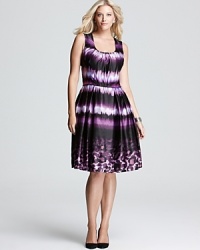 Send your style on an exotic quest in this Melissa Masse Plus dress flaunting a vibrant rush of ikat trimmed with a leopard-print hemline. Send your style on an exotic quest in this Melissa Masse Plus dress flaunting a vibrant rush of ikat trimmed with a leopard-print hemline.