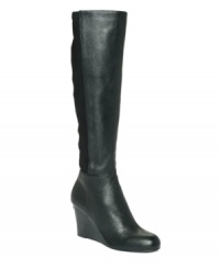 The stark simplicity of MICHAEL Michael Kors' Bromley wedge boots makes them a timeless look you'll turn to again and again. Crafted in leather with a 3 stacked wedge heel, they include elastic insert detailing for enhanced fit and comfort. The stark simplicity of MICHAEL Michael Kors' Bromley wedge boots makes them a timeless look you'll turn to again and again. Crafted in leather with a 3 stacked wedge heel, they include elastic insert detailing for enhanced fit and comfort.
