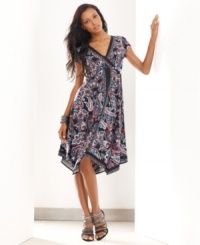 A vibrant paisley print and handkerchief hem lend an exotic look to INC's easy dress.