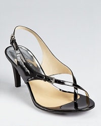 In slick patent, these MICHAEL Michael Kors sandals take a modern stance on a classic silhouette. Shining silver-tone buckles and a stacked heel add fashion-forward appeal. In slick patent, these MICHAEL Michael Kors sandals take a modern stance on a classic silhouette. Shining silver-tone buckles and a stacked heel add fashion-forward appeal.
