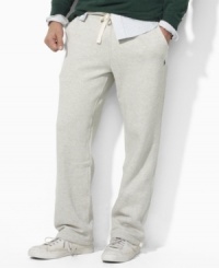 A classic-fitting drawstring pant in soft fleece is designed for casual comfort and style. A classic-fitting drawstring pant in soft fleece is designed for casual comfort and style.