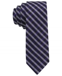 Enter the stripe zone with sleek style. This skinny tie from Calvin Klein lets you power up with a pattern play. Enter the stripe zone with sleek style. This skinny tie from Calvin Klein lets you power up with a pattern play.
