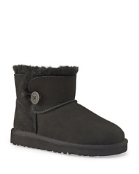 A trimmer take on UGG®'s classic, this medium-rise suede boot is trimmed with shearling and accented with a logo button at the side. A trimmer take on UGG®'s classic, this medium-rise suede boot is trimmed with shearling and accented with a logo button at the side.