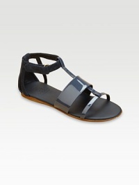 A modern look in velvety suede and polished patent, combining wide and narrow straps and a graceful ankle wrap.Suede and patent leather upperGrip-tape close ankle strap with embossed logo on tabLeather sole with non-slip rubber finishMade in Italy A modern look in velvety suede and polished patent, combining wide and narrow straps and a graceful ankle wrap.Suede and patent leather upperGrip-tape close ankle strap with embossed logo on tabLeather sole with non-slip rubber finishMade in Italy