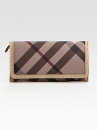 Stay organized in this sleek flap-front silhouette crafted in signature check canvas with leather trim.Flap snap closureOne outside open pocket under flapFour outside credit card slots under flapOne inner top-zip pocketTwo inner compartmentsTen credit card slotsThree inside open pocketsFully lined7½W X 4H X 1DImported Stay organized in this sleek flap-front silhouette crafted in signature check canvas with leather trim.Flap snap closureOne outside open pocket under flapFour outside credit card slots under flapOne inner top-zip pocketTwo inner compartmentsTen credit card slotsThree inside open pocketsFully lined7½W X 4H X 1DImported