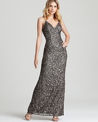 In showstopping sequins, Adrianna Papell's dazzling long dress lends timeless glamour. In showstopping sequins, Adrianna Papell's dazzling long dress lends timeless glamour.