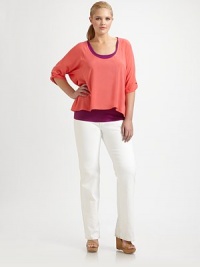 Offering a relaxed fit and an on-trend look, a vibrant design featuring a contrasting tank for a playful colorblock effect.U-neckDolman sleevesHigh-low hemAbout 27 from shoulder to hemRayon; tank: 90% supima cotton/10% spandexDry cleanMade in USA Offering a relaxed fit and an on-trend look, a vibrant design featuring a contrasting tank for a playful colorblock effect.U-neckDolman sleevesHigh-low hemAbout 27 from shoulder to hemRayon; tank: 90% supima cotton/10% spandexDry cleanMade in USA