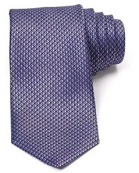 Incredible texture defines this luxurious silk tie from Michael Kors, the perfect pizzazz piece for special occasions or a fine addition to your professional wardrobe.