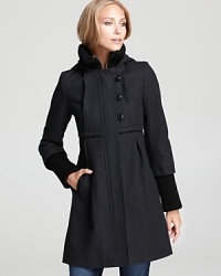A knit collar and cuffs perfectly accents this babydoll-style DKNY coat, flaunting pretty pleats at the front and back and toggle closures for a charming finish. A knit collar and cuffs perfectly accents this babydoll-style DKNY coat, flaunting pretty pleats at the front and back and toggle closures for a charming finish.