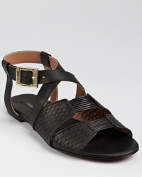 Bold hardware and perforated details lend an ultra-modern feel to these Rachel Zoe sandals, an effortless style standout. Bold hardware and perforated details lend an ultra-modern feel to these Rachel Zoe sandals, an effortless style standout.