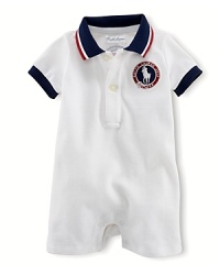 A preppy short-sleeved polo shortall in breathable stretch cotton mesh is accented with USA patching, celebrating Team USA's participation in the 2012 Olympics. A preppy short-sleeved polo shortall in breathable stretch cotton mesh is accented with USA patching, celebrating Team USA's participation in the 2012 Olympics.