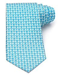 A classic silk tie from Salvatore Ferragamo, showcasing a charming chick print. A classic silk tie from Salvatore Ferragamo, showcasing a charming chick print.