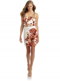 THE LOOKVibrant flower printFront straps extend and crisscross in backContrast piped self-belt at Empire waistWaist dartsSide zipper with hook-and-eye closureTHE FITAbout 35 from shoulder to hemTHE MATERIALPolyesterCARE & ORIGINDry cleanImportedModel shown is 5'11 (180cm) wearing US size 4. THE LOOKVibrant flower printFront straps extend and crisscross in backContrast piped self-belt at Empire waistWaist dartsSide zipper with hook-and-eye closureTHE FITAbout 35 from shoulder to hemTHE MATERIALPolyesterCARE & ORIGINDry cleanImportedModel shown is 5'11 (180cm) wearing US size 4.
