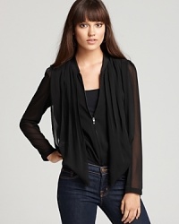 Sheer and whisper-light with a stylish draped front, this chic little chiffon GUESS jacket features a chameleon-like silhouette for you to sport as both a top or jacket. Sheer and whisper-light with a stylish draped front, this chic little chiffon GUESS jacket features a chameleon-like silhouette for you to sport as both a top or jacket.