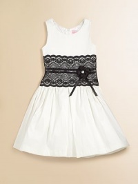 She'll want to twirl in this gorgeous, shiny shantung frock with lace inset, ribbon belt and full skirt.ScoopneckSleevelessBack zipperWaistband with ribbon belt and flowerFull gathered skirtFully linedPolyesterDry cleanMade in the USA of imported fabric She'll want to twirl in this gorgeous, shiny shantung frock with lace inset, ribbon belt and full skirt.ScoopneckSleevelessBack zipperWaistband with ribbon belt and flowerFull gathered skirtFully linedPolyesterDry cleanMade in the USA of imported fabric