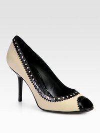 A brogue-inspired peep toe silhouette in rich canvas and patent leather with traditional perforations. Stacked heel, 3½ (90mm)Canvas and patent leather upperPeep toeLeather lining and solePadded insoleMade in Italy A brogue-inspired peep toe silhouette in rich canvas and patent leather with traditional perforations. Stacked heel, 3½ (90mm)Canvas and patent leather upperPeep toeLeather lining and solePadded insoleMade in Italy