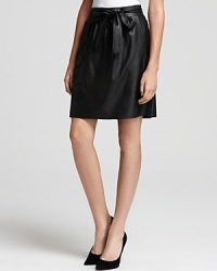 Luxe in leather, this Elie Tahari skirt is sweet with a side bow and edgy with an exposed zip closure. Luxe in leather, this Elie Tahari skirt is sweet with a side bow and edgy with an exposed zip closure.
