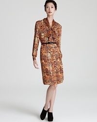 Work the abstract in a tiger print Escada shirt dress, rendered in sumptuous silk. Work the abstract in a tiger print Escada shirt dress, rendered in sumptuous silk.