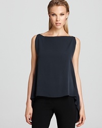 A stretch-silk Armani Collezioni blouse is the perfect piece to team with elegant suit separates when the boardroom calls. A stretch-silk Armani Collezioni blouse is the perfect piece to team with elegant suit separates when the boardroom calls.