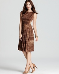 Embrace a classic feminine silhouette as a fit-and-flare Jones New York Collection dress enlivens a crisp exotic print with a delicately pleated skirt. Embrace a classic feminine silhouette as a fit-and-flare Jones New York Collection dress enlivens a crisp exotic print with a delicately pleated skirt.